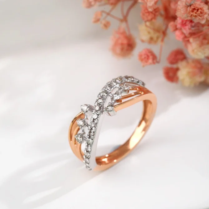 A gold and silver ring with diamonds