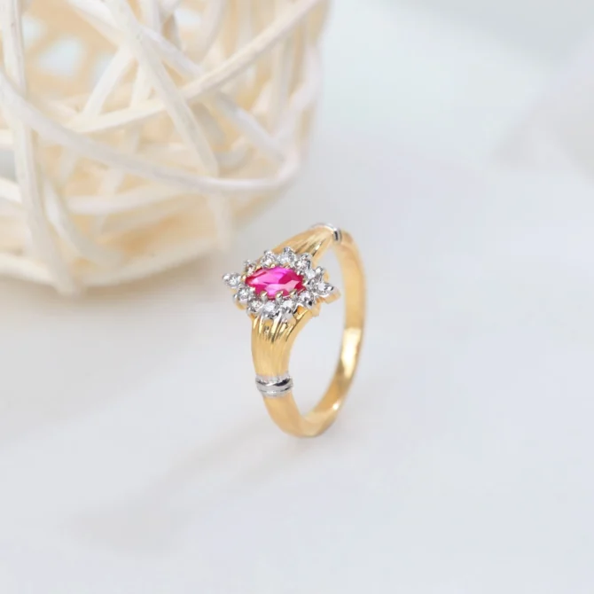 A pink stone diamond ring